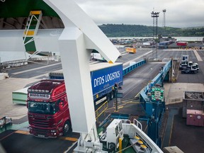 A haulage truck boards a ferry at Larne Port in Larne, Northern Ireland. Photographer: Emily Macinnes/Bloomberg