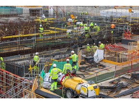 Contractors work near the Unit 1 nuclear reactor at Hinkley Point C nuclear power station construction site in Bridgwater, UK, on Wednesday, July 20, 2022. The two reactors are supposed to be blazing a trail for a nuclear renaissance in Britain, as the government seeks to boost the country's energy independence and reduce its reliance on fossil fuels. Photographer: Hollie Adams/Bloomberg