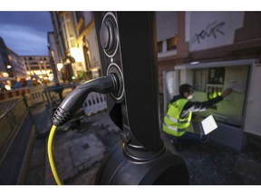 A street-side electric vehicle charging station during its installation in Frankfurt.