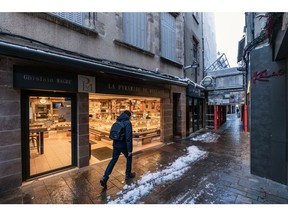 A pedestrian walks past a bakery on a path cleared of snow in Rodez, France, on Friday, Jan. 20, 2023. Freezing temperatures are expected to persist across parts of western Europe, including France and northern Spain, into next week, before recovering toward seasonal norms, Maxar Technologies said in a report. Photographer: Balint Porneczi/Bloomberg