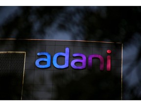 Signage atop the Adani Group headquarters in Ahmedabad, India, on Wednesday, Feb. 1, 2023.  Bonds of the Indian billionaire's flagship firm plunged to distressed levels in US trading, and the company abruptly pulled a record domestic stock offering after the Adani group suffered a $92 billion market crash. Photographer: Dhiraj Singh/Bloomberg