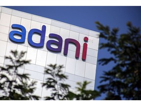 Signage atop the Adani Group headquarters in Ahmedabad, India, on Wednesday, Feb. 1, 2023. The crisis of confidence plaguing Gautam Adani is deepening, with the stock rout triggered by Hindenburg Research's fraud allegations erasing a third of the market value in his group's companies despite the completion of a key share sale. Photographer: Dhiraj Singh/Bloomberg