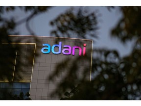 Signage atop the Adani Group headquarters in Ahmedabad, India, on Wednesday, Feb. 1, 2023. Bonds of the Indian billionaire's flagship firm plunged to distressed levels in US trading, and the company abruptly pulled a record domestic stock offering after the Adani group suffered a $92 billion market crash.