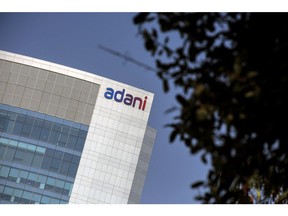 Signage atop the Adani Group headquarters in Ahmedabad, India, on Wednesday, Feb. 1, 2023. The crisis of confidence plaguing Gautam Adani is deepening, with the stock rout triggered by Hindenburg Research's fraud allegations erasing a third of the market value in his group's companies despite the completion of a key share sale. Photographer: Dhiraj Singh/Bloomberg
