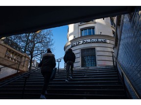 Pedestrians exit a metro station at the headquarters of BNP Paribas SA bank, in Paris, France, on Monday, Feb. 6, 2023. BNP Paribas kicks off earnings season for French banks, reporting quarterly numbers Tuesday before the market opens in Paris.