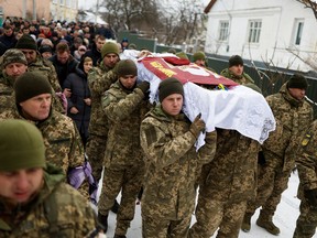 The funeral for Ukrainian decathlete Volodymyr Androshchuk in Letychiv, Ukraine, February 1, 2023. "He could have been able to participate in the Olympic Games in Paris, if Russia hadn't invaded Ukraine. Why do Russians still have this privilege?"