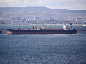 FILE - An oil tanker is moored at the Sheskharis complex, part of Chernomortransneft JSC, a subsidiary of Transneft PJSC, in Novorossiysk, Russia, on Oct. 11, 2022. A Russian official says the country will will cut oil production by 500,000 barrels per day next month in response to the West capping the price of its crude over the war in Ukraine. According to multiple Russian news media reports, Deputy Prime Minister Alexander Novak said Friday, Feb. 10, 2023 that "we will not sell oil to those who directly or indirectly adhere to the 'price ceiling.'" (AP Photo, File)