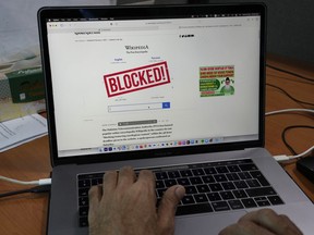 A computer screen displays a notice blocking the Wikipedia website through an online news site in Islamabad, Pakistan, Monday, Feb. 6, 2023. Pakistan's media regulator said Monday it blocked Wikipedia services in the country for hurting Muslim sentiment by not removing allegedly blasphemous content from the site.