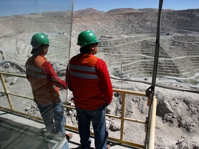 Workers at a BHP copper mine in Chile.