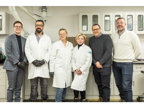 Québec Minister Caroline Proulx and President & CEO Eric Desaulniers pose with members of NMG's R&D team at the Company's Phase-1 facilities during the announcement of the financial levers.