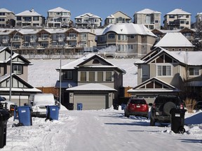 Houses line a street in a subdivision in Calgary, Alta., Wednesday, Feb. 8, 2017.