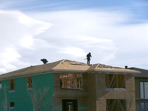 Construction workers at a new building in Calgary.