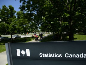 Statistics Canada building and signs are pictured in Ottawa on Wednesday, July 3, 2019. Statistics Canada says Black-owned businesses in Canada tend to be smaller and perform less well financially than businesses owned by white people or other racialized groups. Research has shown the Black business community is under-represented when it comes to research and data.
