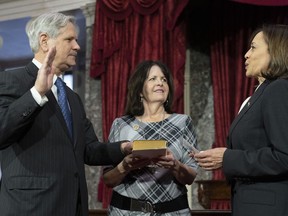 Vice President Kamala Harris participates in a ceremonial swearing-in of Sen. John Hoeven, R-N.D., with his wife Mical "Mikey" Hoeven, in the Old Senate Chamber on Capitol Hill in Washington, Tuesday, Jan. 3, 2023.