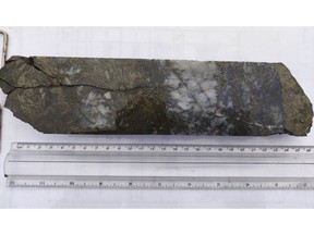 Part of a split section of drill core from hole FR-DD-22-UG-192 grading 42.8 g/t Au and 432 g/t Ag over a core length of 0.36 metres.
