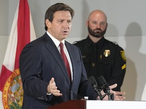 Governor Ron DeSantis gestures during a news conference where he spoke of new law enforcement legislation that will be introduced during the upcoming session, Thursday, Jan. 26, 2023, in Miami.
