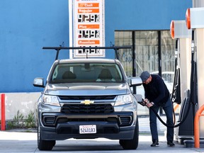 A person fills their tank at a gas station in Los Angeles, Calif. Gas prices in the U.S. rose 3.6 per cent in January.