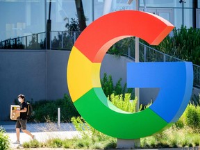 A worker walks along a path at Google's Bay View campus in Mountain View, Calif.