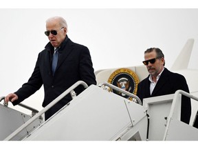 President Joe Biden, left, and Hunter Biden, arrive at Hancock Field Air National Guard Base in Syracuse, New York, on Feb. 4. Photographer: Andrew Caballero-Reynolds/AFP/Getty Images