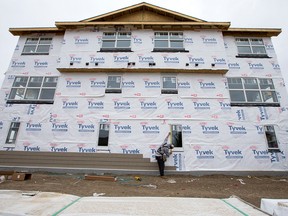 A builder works on a house in Saskatoon, Sask. Of Canada’s three biggest markets, only Montreal saw housing starts pick up in January, increasing 36 per cent.