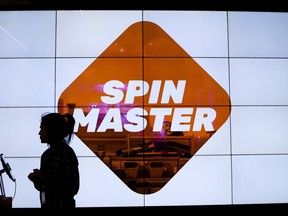 A person is silhouetted at the Spin Master toy and entertainment company in Toronto on January 29, 2019.