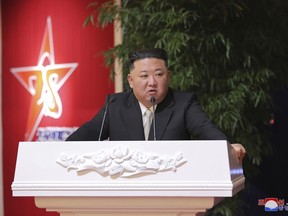 In this photo provided by the North Korean government, North Korean leader Kim Jong Un delivers a speech during a feast to mark the 75th founding anniversary of the Korean People's Army at an unspecified place in North Korea Tuesday, Feb. 7, 2023. Independent journalists were not given access to cover the event depicted in this image distributed by the North Korean government. The content of this image is as provided and cannot be independently verified. Korean language watermark on image as provided by source reads: "KCNA" which is the abbreviation for Korean Central News Agency. (Korean Central News Agency/Korea News Service via AP)