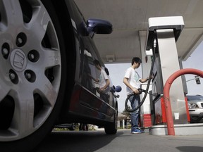 FILE - A motorist fuels up at a gas station in Santa Cruz, Calif., Monday, March 7, 2011. A leak in a fuel pipeline facility in California has forced a shutdown of deliveries of gasoline and diesel from the Los Angeles to areas including Las Vegas and Phoenix.