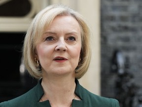 FILE - Outgoing British Prime Minister Liz Truss speaks outside Downing Street in London, on Oct. 25, 2022. Writing in the Sunday Telegraph newspaper on Sunday, Feb. 5, 2023, Truss says it wasn't her fault. Truss alleges that a "powerful economic establishment" and opponents inside the governing Conservative Party thwarted her plans for a tax-cutting overhaul of the U.K. economy.