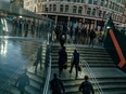 Morning commuters exit Liverpool Street railway station in the City of London, U.K.