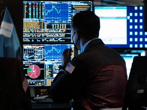 Traders work on the floor of the New York Stock Exchange.