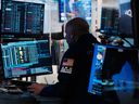 Traders work on the floor of the New York Stock Exchange.