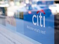 Signage is displayed in the window of a Citigroup Inc. Citibank branch in Chicago, Illinois.