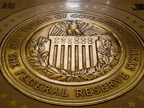 FILE- In this Feb. 5, 2018, file photo, the seal of the Board of Governors of the United States Federal Reserve System is displayed in the ground at the Marriner S. Eccles Federal Reserve Board Building in Washington.Richmond Federal Reserve President Thomas Barkin on Friday, Feb. 17, 2023 downplayed recent signs that the economy is strengthening, but also said he is prepared to keep raising interest rates in smaller increments as often as needed to quell inflation.