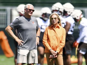 FILE - Cleveland Browns owners Jimmy, left, and Dee Haslam look on during the NFL football team's training camp, on July 28, 2022, in Berea, Ohio. Browns owners Dee and Jimmy Haslam are in talks to buy a minority stake in the NBA's Milwaukee Bucks, a person familiar with the negotiations told the Associated Press on Friday, Feb. 10, 2023. The Haslams, who have explored interest in buying other pro teams in the past, are interested in the 25% share currently held by Marc Lasry, said the person who spoke on condition of anonymity because of the sensitivity of the situation.