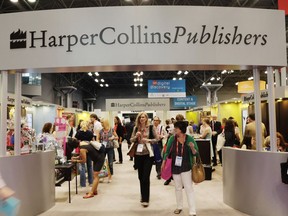 FILE - Attendees at BookExpo America visit the HarperCollins Publishers booth in New York on May 28, 2015.