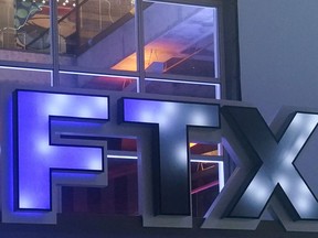 FILE - The logo for cryptocurrency company FTX is displayed on the arena once known as FTX Arena, and now called Miami-Dade Arena, on Nov. 12, 2022, in Miami. Cryptocurrency companies grabbed the spotlight during the 2022 Super Bowl with commercials from a handful of newcomers to advertising's biggest stage. A year later, the industry has been humbled by a massive downturn in crypto prices, as well as the bankruptcy of several well-known companies.