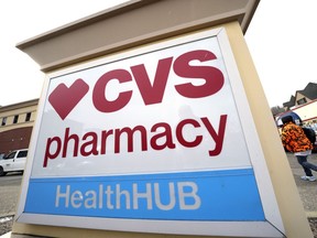 A CVS store sign is displayed in Pittsburgh on Friday, Feb. 3, 2023. CVS Health is plunging deeper into primary care services, buying Oak Street Health for approximately $10.6 billion. The drugstore chain said Wednesday, Feb. 8, 2023, it would pay $39 per share in cash for each share of Oak Street Health in a deal expected to close this year.