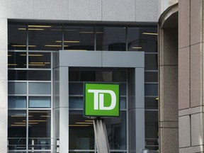 Toronto Dominion Bank signage is pictured in Ottawa on Wednesday Sept. 7, 2022. TD Bank Group says it will pay US$1.205 billion to settle a lawsuit in connection with a multi-year Ponzi scheme operated by the Stanford Financial Group.