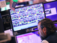 Traders work the floor of the New York Stock Exchange