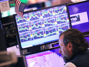 Traders work the floor of the New York Stock Exchange