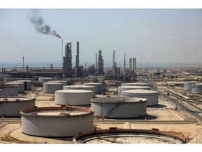 Storage tanks and oil processing facilities operate at Saudi Aramco's Ras Tanura oil refinery and terminal in Ras Tanura, Saudi Arabia, on Monday, Oct. 1, 2018.