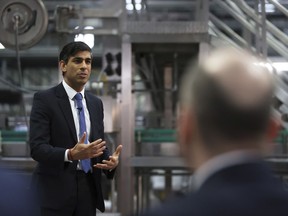 Britain's Prime Minister Rishi Sunak holds a Q&A session with local business leaders during a visit to Coca-Cola HBC in Lisburn, Northern Ireland, Tuesday Feb. 28, 2023. Sunak traveled to Belfast on Tuesday to sell his landmark agreement with the European Union to its toughest audience: Unionist politicians who fear post-Brexit trade rules are weakening Northern Ireland's place in the United Kingdom.