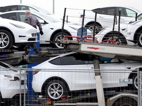 New Teslas being loaded on a truck