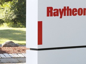 FILE - A sign stands at the road leading to the Raytheon facility in Marlborough, Mass., on June 10, 2019. China on Thursday, Feb. 16, 2023, imposed trade and investment sanctions on U.S. military contractors Lockheed Martin and Raytheon for supplying weapons to Taiwan, stepping up efforts to isolate the island democracy claimed by the ruling Communist Party as part of its territory.