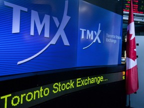 MX Group Inc. signage is displayed on a screen in the broadcast centre of the Toronto Stock Exchange.