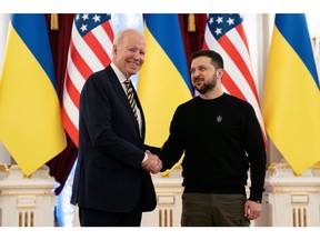 Joe Biden shakes hands with Volodymyr Zelensky at the Mariinsky Palace in Kyiv on February 20. Photographer: Evan Vucci/AFP/Getty Images
