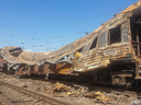 A heavily burned rail car sits on the tracks following a Russian air strike on a train station in the town of Chaplyne, Dnipropetrovsk region in Ukraine.