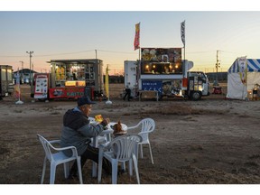 The former site of Tomioka Junior High School, now lined with food trucks, is used to promote the area's reconstruction. Photographer: Noriko Hayashi/Bloomberg