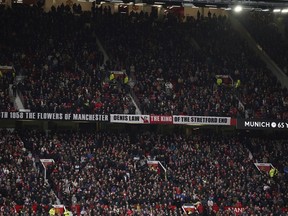 A tribute to Manchester United team - nicknamed the "Busby Babes" is displayed on screen in memory of the 65th anniversary of the Munich air disaster which saw 23 people die, prior the English Premier League soccer match between Manchester United and Crystal Palace, at the Old Trafford stadium in Manchester, England, Saturday, Feb. 4, 2023. The plane was carrying the Manchester United team - nicknamed the "Busby Babes".