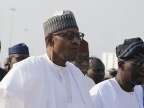 Nigeria's President, Muhammadu Buhari, Left, arrived to Commission the Lekki deep seaport in Lagos, Nigeria, Monday, Jan. 23, 2023. Nigeria's President Muhammadu Buhari on Monday commissioned a Chinese-built and -funded $1.5 billion deep seaport in the commercial hub of Lagos with authorities optimistic the project would help grow the West African nation's ailing economy.